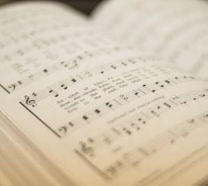 shallow focus photography of musical note book