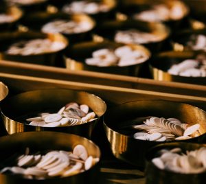 selective focus photography of coins on round container