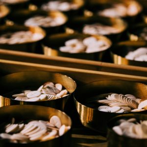 selective focus photography of coins on round container