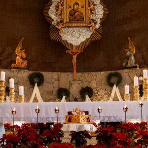 gold cross on brown wall