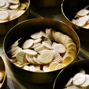 white and brown round food on black ceramic bowl