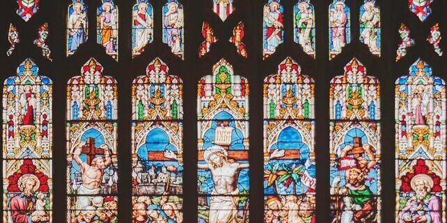photo by k. mitch hodge a large stained glass window in a church